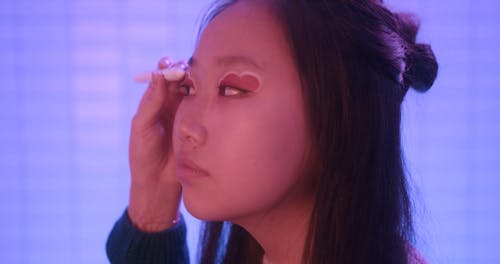 Close-Up View of a Girl Getting an Eyeshadow