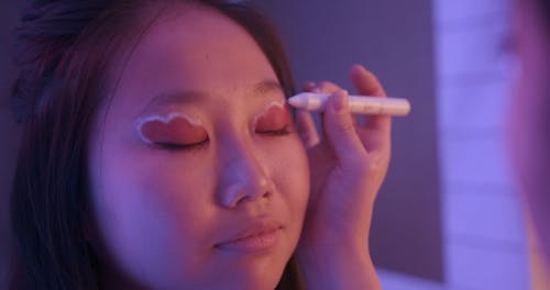 Close-Up View of a Girl Getting an Eyeshadow