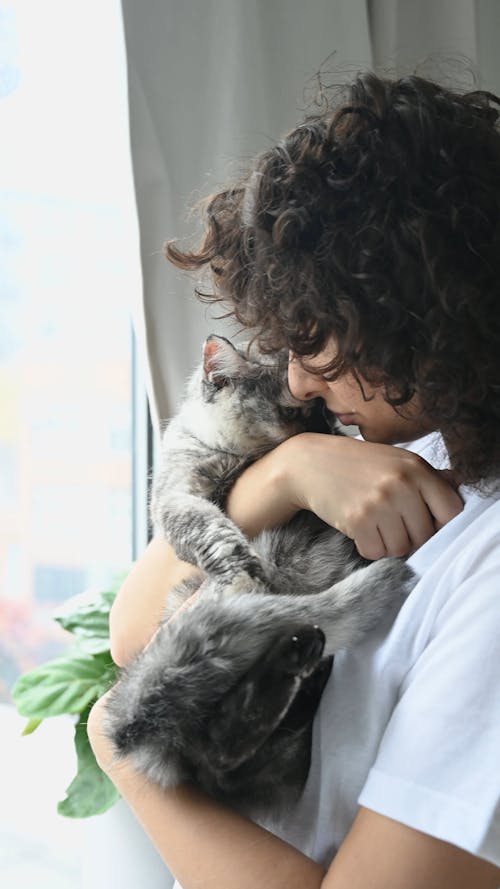 Woman Cuddling Her Cat