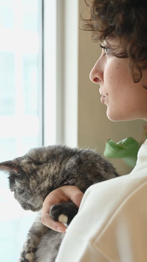 Woman Cuddling Her Cat