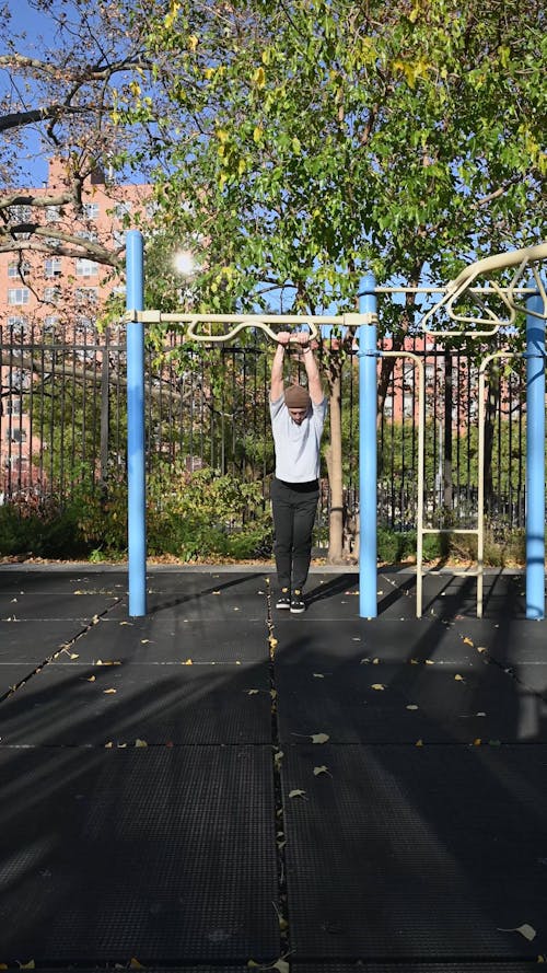 Man Doing Parkour on a Playground