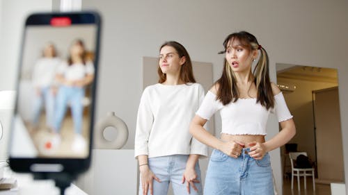 Two Young Women Recording a Dance Video