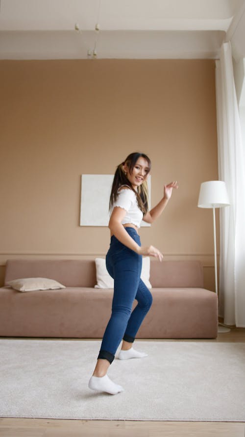 A Woman Dancing At Home
