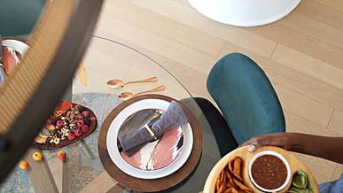 setting food platters on the dining table