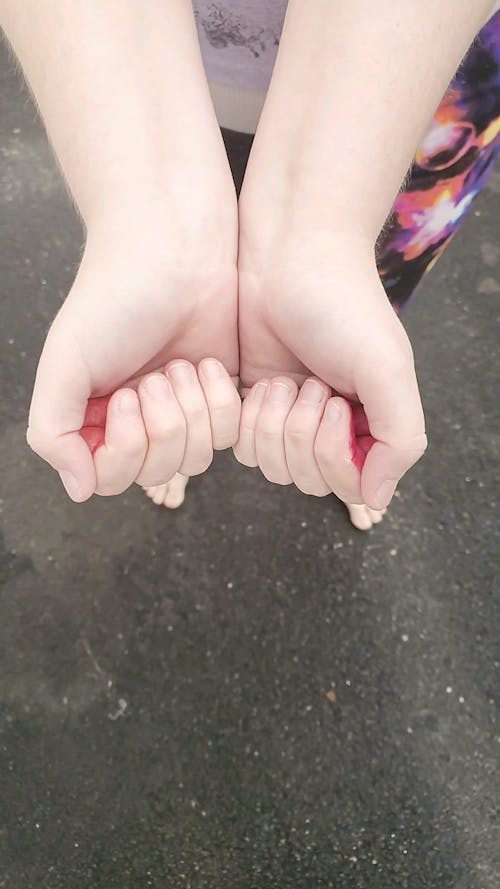 High Angle Shot of Hands of a Person
