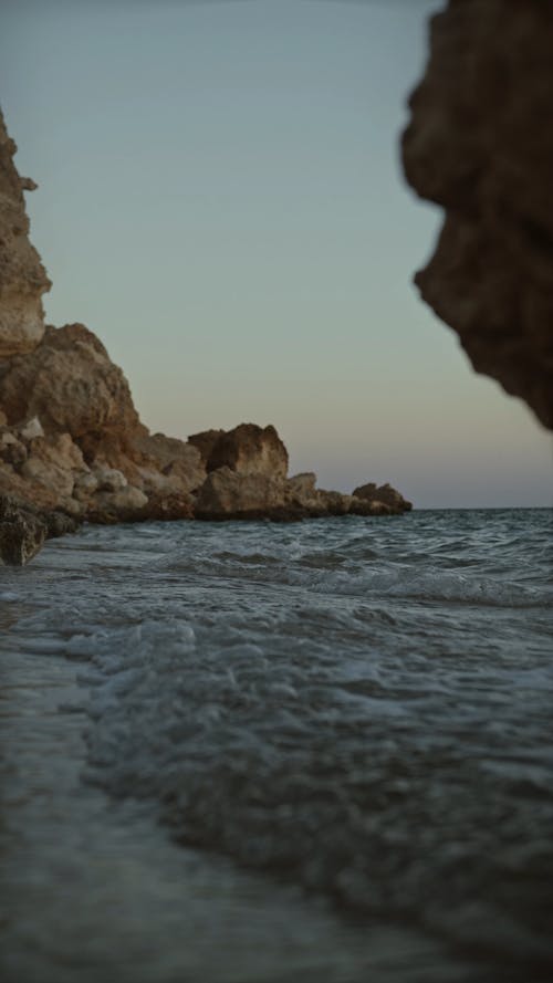 Sea Waves Crashing The Cliff Coast