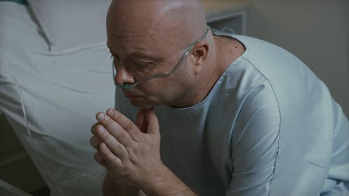 A Man Looking Worried Confines In The Hospital