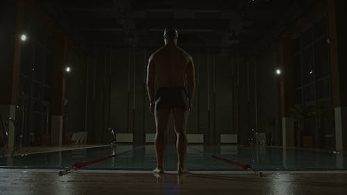 A Man Diving In The Pool