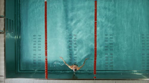 A Woman Swimming In The Pool