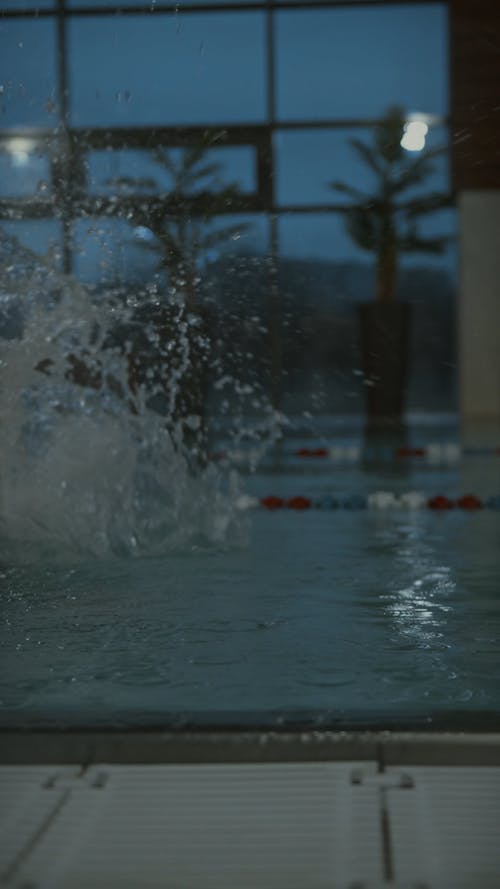 A Young Athlete Training In Swimming