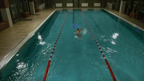 A Man Swimming Freestyle In The Pool
