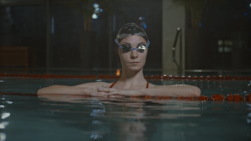 A Woman Dipping In A Swimming Pool
