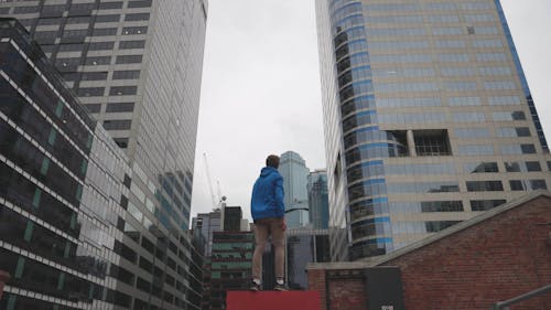 Young Person Looking at Skyscrapers