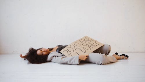 A Tired Woman Lying on the Floor
