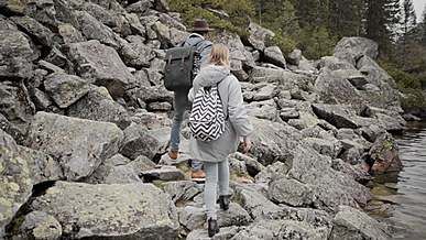 couple climbing mountain