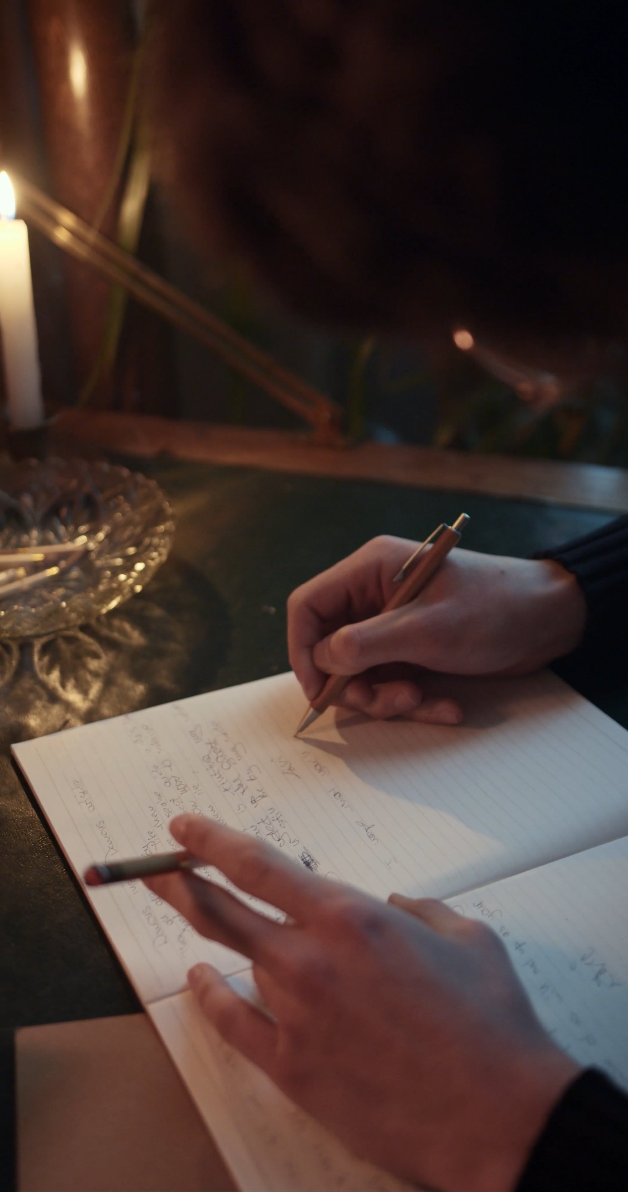 Close Up View of a Man Writing on a Notebook · Free Stock Video