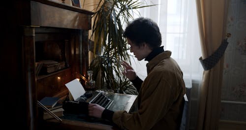 A Man Using a Type Writer