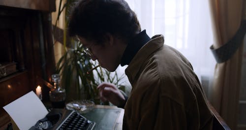 A Man Using a Typewriter 