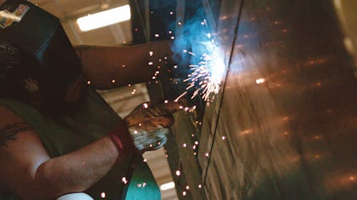 A Worker Welding Steel