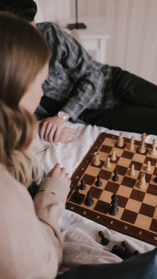 Man and Woman Playing Chess