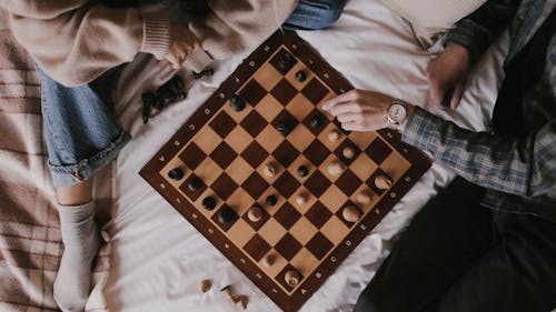 Man and Woman Playing Chess