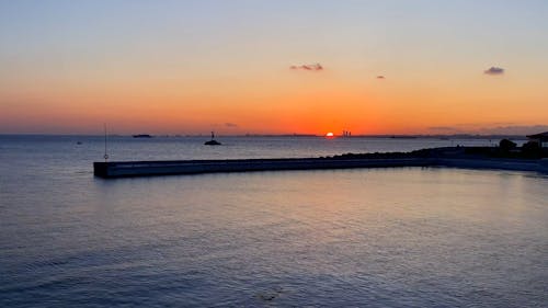 A Footage of a Sunset in a Harbor