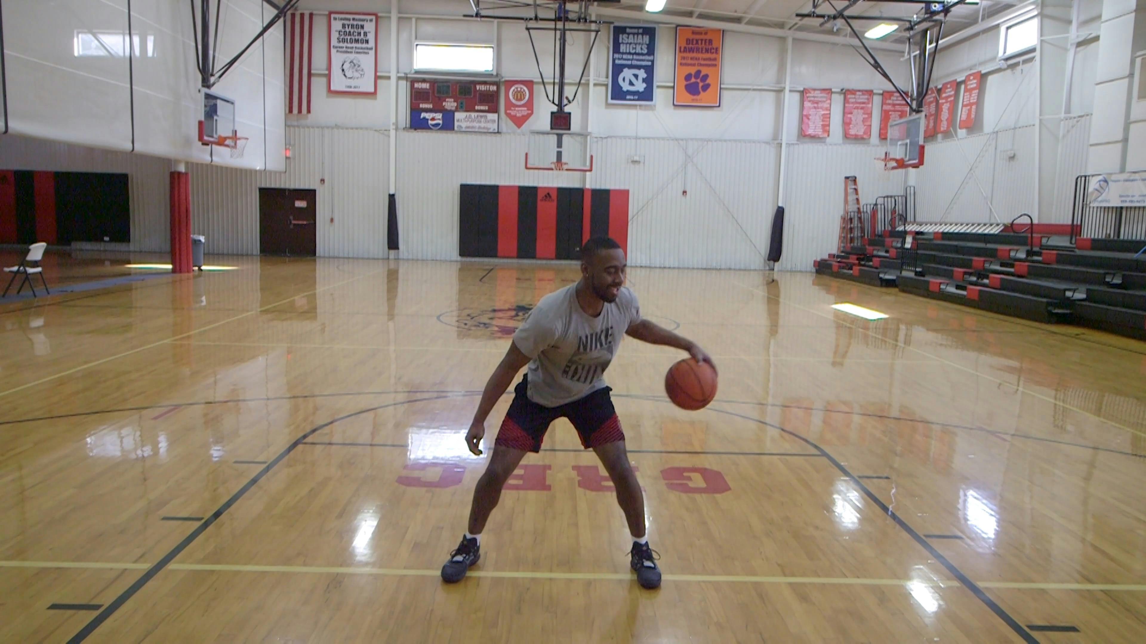 Man Dribbling a Ball Inside a Basketball Court · Free Stock Video