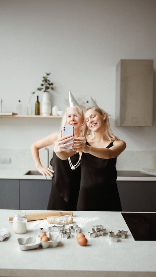 A Mother And Daughter Having Fun In Baking