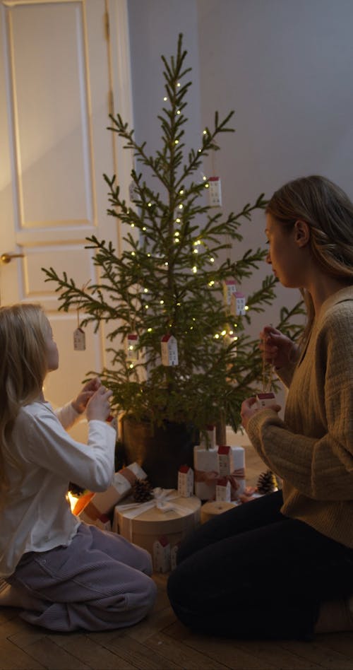 Family Decorating a Christmas Tree