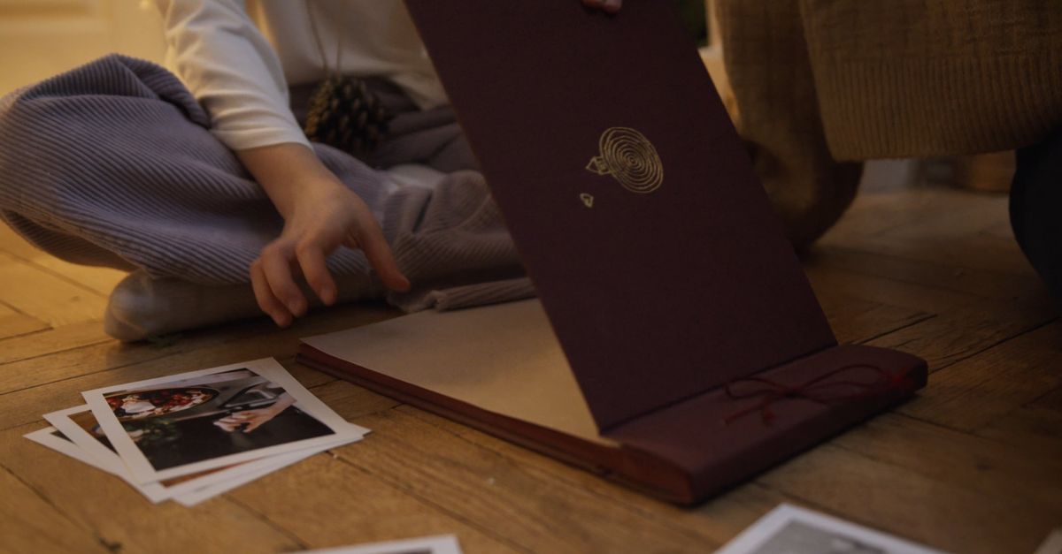 Video/photo Alb Family Placing Photgraphies on Photo Album Free Stock Video Footage ...