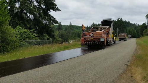A Truck Paving a Road