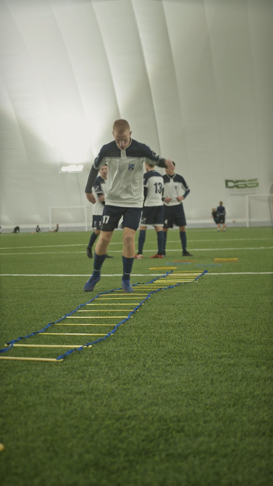 Athletes running training drills