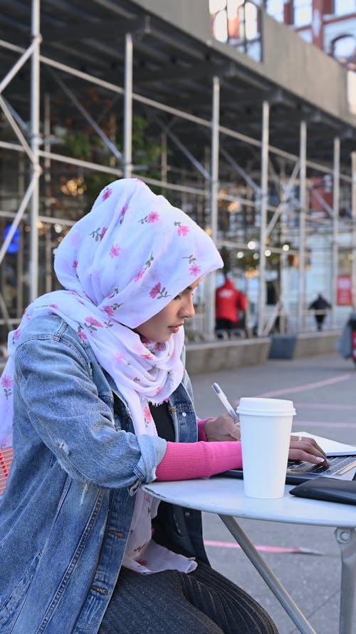 Woman Wearing Hijab Writing