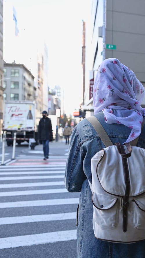 Person Wearing Hijab Crossing the Street