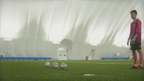  Football Player Training in Airdome