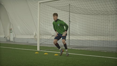 A Soccer Player Training on the Field