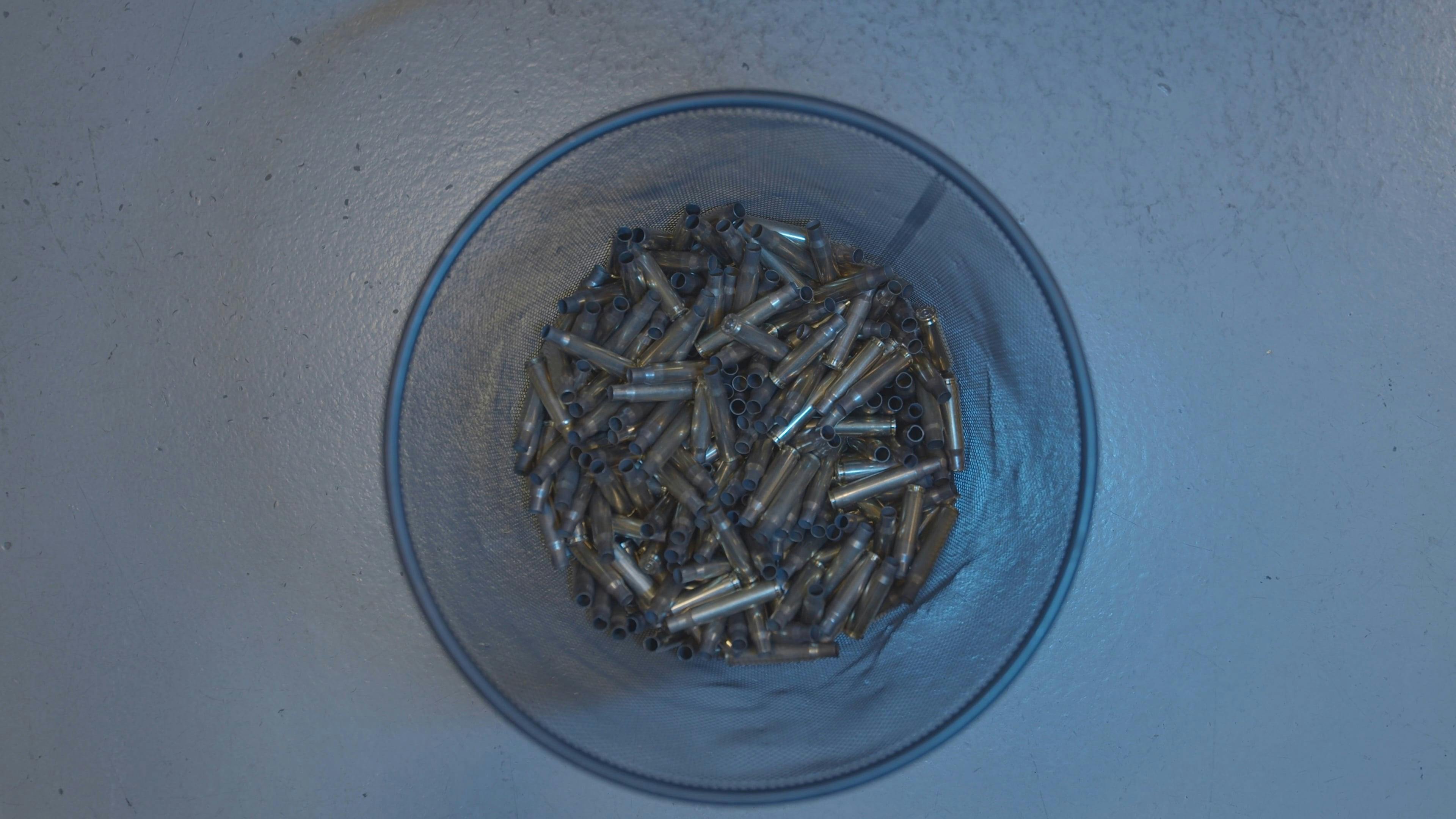 Empty Bullet Shells in a Bin · Free Stock Video