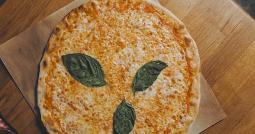 Close-up Shot of a Cheesy Pizza