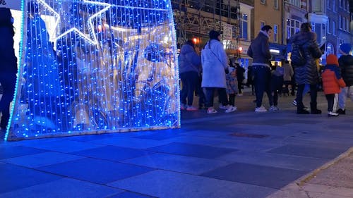 Pedestrians on Crowded Street at Christmas Time