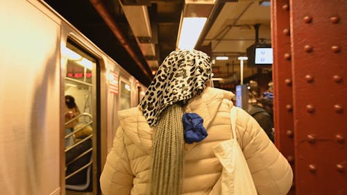 Woman Walking in Train Station