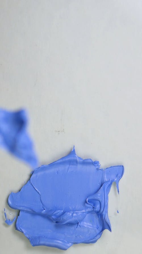 Mixing Blue Color with a Spatula