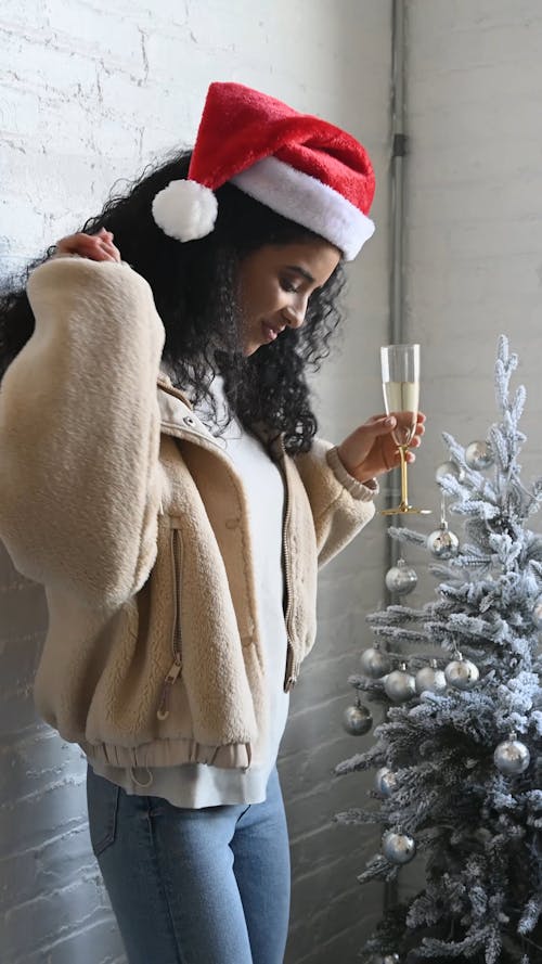 A Woman Dancing while Holding a Glass of Champagne