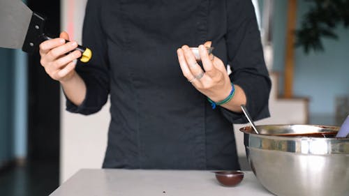 Crop Person Preparing Chocolate Candies