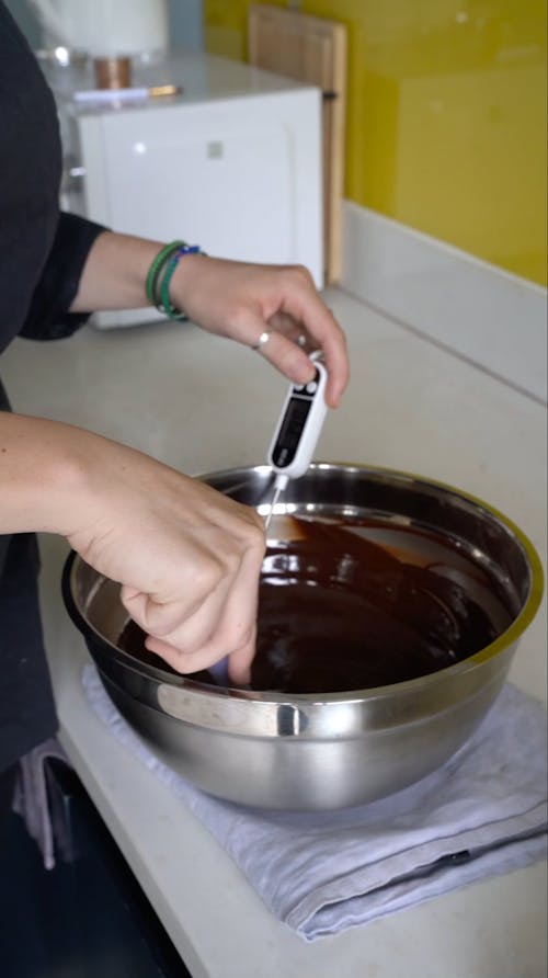 Person Mixing Chocolate in a Bowl
