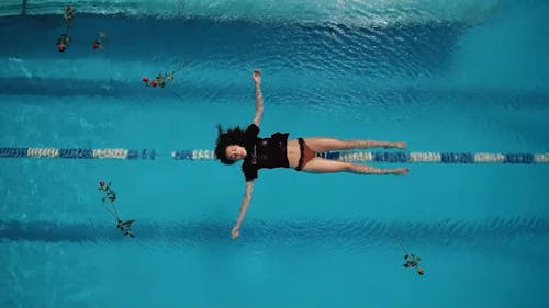 A Woman Floating in the Pool