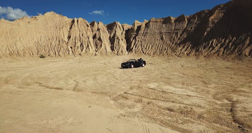 A Black Convertible Amidst the Desert