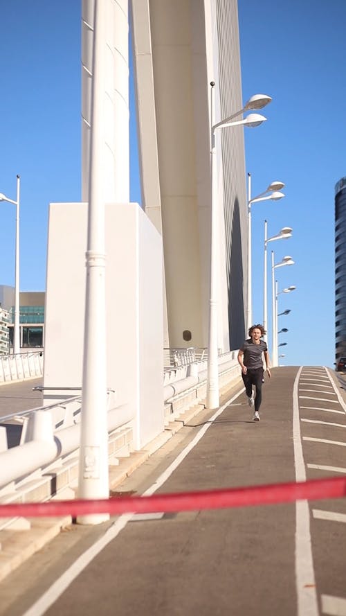 A Man Running on the Sidewalk