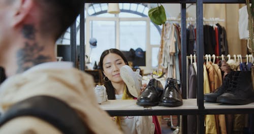 A Woman Choosing a Shoe
