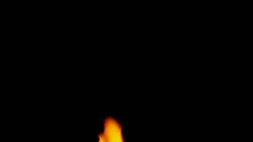 Burning Flame on a Dark Background