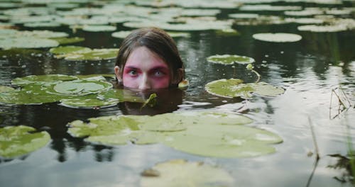 Shirtless Man Submerging in the Lake 